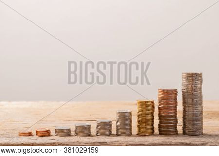 Coin Stack On Real Wood With Soft White Color, Good For Save Money Background, Or Business Growing