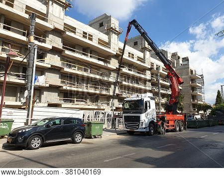 Holon, Israel. August 11, 2020. Construction Crane Working At A Construction Site Of A New Residenti
