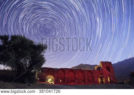 Night View Of The Castle. A View Of The Stars Of The Milky Way With A Mountain Top In The Foreground