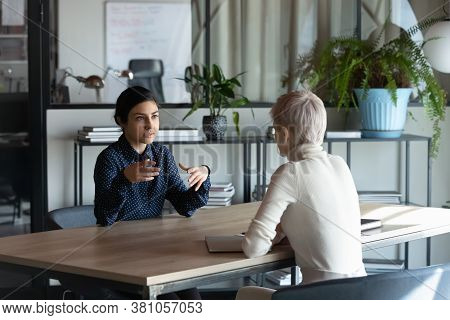 Focused Young Indian Job Seeker Self-presenting On Interview.