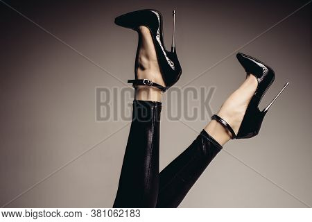 Lender Female Legs In Spandex Catsuit And A Fetish Shoe With Extremely High Heels. Bdsm Theme.