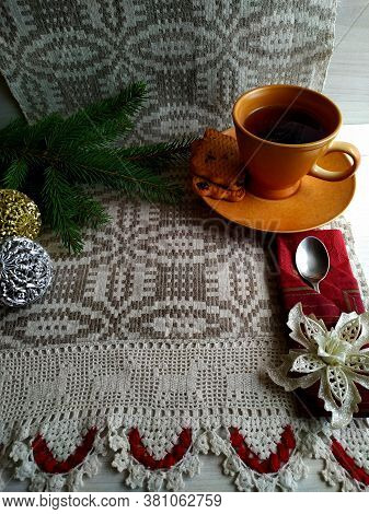 Christmas Tea On Linen Tablecloth In The Shaffron Colored Cup.