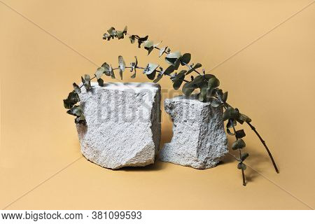 Creative Grey Stone Podium For Cosmetics Or Products On Brown Beige Background. Modern Layout With T
