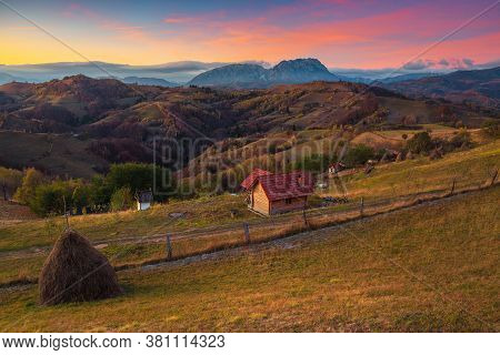 Picturesque Autumn Rural Scenery With Gardens And Colorful Sky At Sunrise, Holbav, Transylvania, Rom
