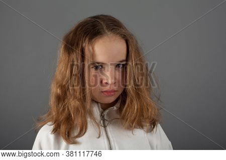Cute Teenage Blond Girl In White Hoody With Slanting Eyes
