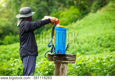 Farmers Are Preparing Insecticide Spraying In Soybean Field. Copy Space For Text. Concept Of Campaig