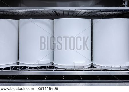 White Plastic Buckets For The Production Of Pharmaceuticals, Vaccines And Pills Sit On A Shelf In A 
