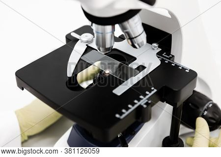 Doctor Woman With Microscope In Laboratory. Scientific Research