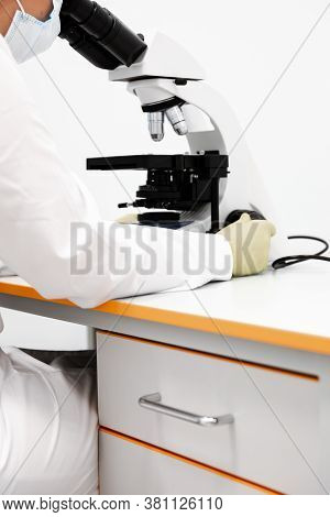 Doctor Woman With Microscope In Laboratory. Scientific Research