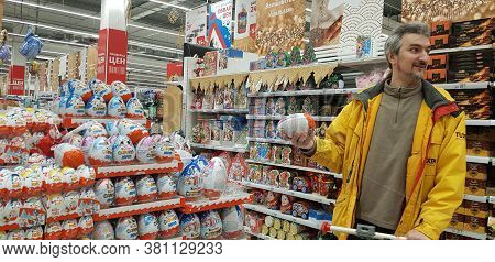 Chocolate Eggs Kinder Surprise In The Supermarket And The Buyer
