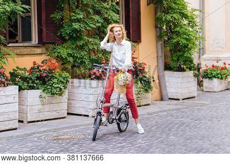 Portrait Of Romantic Mature Slim Blonde Woman In White Shirt Red Pants Enjoying, Walking Outdoor In 