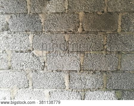 A Wall Made Of Cement Blocks And Concrete Like Texture.each Block Is Differentiated By The Concrete 