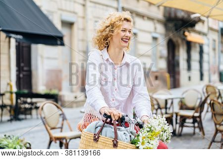 Portrait Of Romantic Mature Slim Blonde Woman In White Shirt Red Pants Enjoying, Walking Outdoor In 