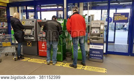 Ussia, St. Petersburg 23.04.2020 People At The Atm With Markings During The Coronavirus Epidemic