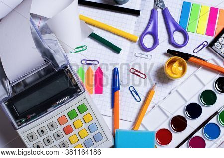 Top View Photo Of Cash Register Recorder With Receipt Tape And Colorful Stationery Isolated On White