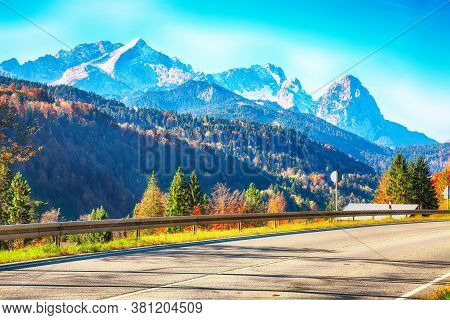 Asphalt Road Near Wagenbruchsee (geroldsee) Lake  And Zugspitze Mountain Range On Background.. Locat