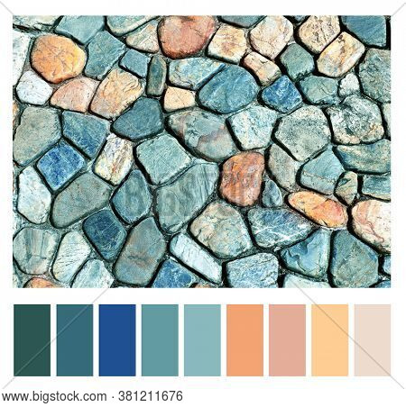 Color matching palette with complimentary colour swatches. Texture of ancient paving stone of blue, gray, red and yellow colors