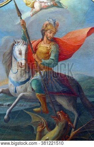 KLANJECKO JEZERO, CROATIA - NOVEMBER 06, 2013: Saint George slaying the dragon, altar painting on the high altar in the chapel of Saint George at the Lake in Klanjecko Jezero, Croatia