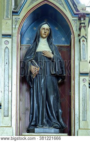 LUKA, CROATIA - SEPTEMBER 16, 2012: St. Margaret Mary Alacoque statue at the altar of the Sacred Heart of Jesus at St. Roch Church in Luka, Croatia