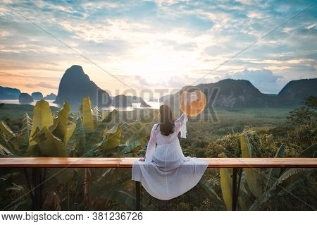 Woman With The White Dress Sit And See The Mountain In Early Morning At Samet Nangshe Viewpoint In A