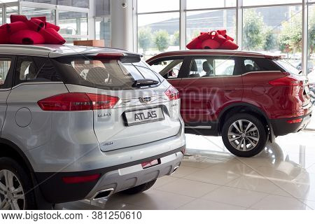 Russia, Izhevsk - August 14, 2020: New Modern Cars Atlas In The Geely Showroom. Back And Side View.