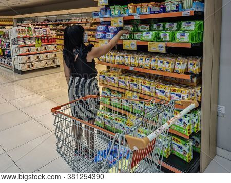 Thessaloniki, Greece - August 13 2020: Female With Covid-19 Protection Mask In Super Market Buys San