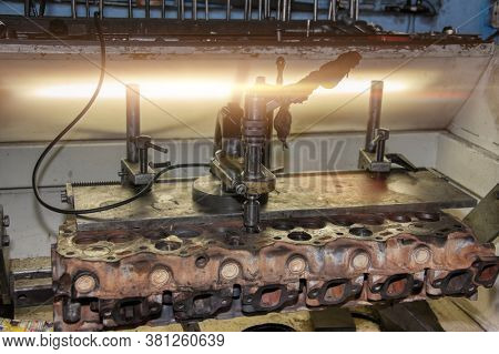 cylinder head taken out for skimming in a workshop