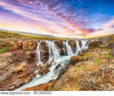 Breathtaking View Of  Kolufossar Waterfall At Sunset.  Popular Tourist Travel Destination In Iceland