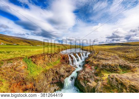 Amazing Kolufossar Waterfall At Summer Sunny Day.  Popular Tourist Travel Destination In Iceland . L
