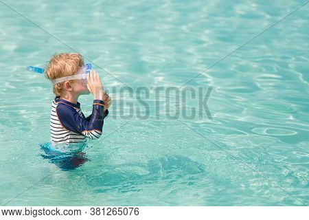 Little Boy Ready For Snorkeling In Beautiful Caribbean Turquoise Waters Enjoying Active Family Vacat