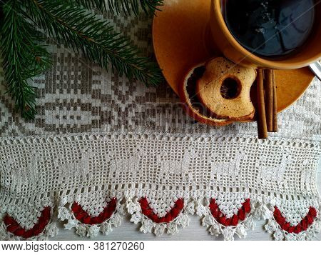 Christmas Tea On Linen Tablecloth In The Shaffron Colored Cup.