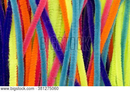 Blue,green,orange,yellow And Pink Colorful Chenille Sticks Background