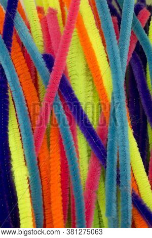 Blue,green,orange,yellow And Pink Colorful Chenille Sticks Background