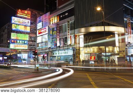 Hong Kong, China -- June 30, 2015 : Night Traffic Through Busy Street In Urban Area In Hong Kong. Wi