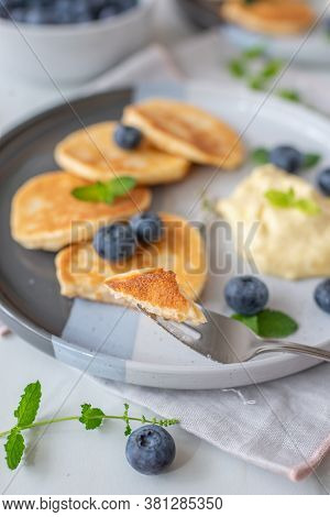 Pancakes With Blueberries And Vanilla Sauce For Breakfast
