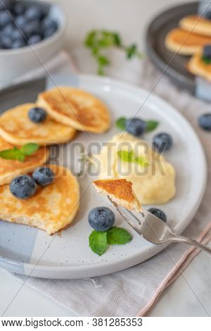 Pancakes With Blueberries And Vanilla Sauce For Breakfast