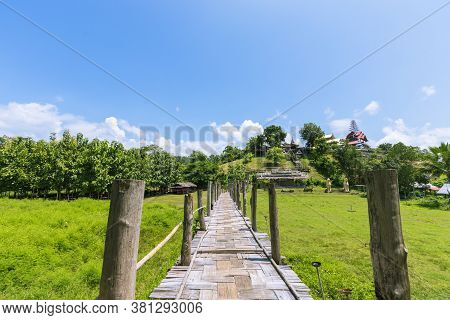 Sutongpe Wooden Bridge That Crosses Rice Fields To Temples In Mae Hong Son Province In Thailand.