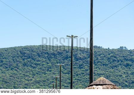 View Of A Kiosk Thatched Roof And Profiled Public Streetlights In Public Areas In The City Of Osorio