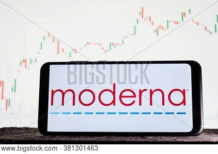 Tula, Russia - August 10, 2020: Logo Moderna On A Smartphone Against The Background Of Stock Market 
