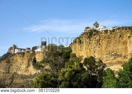 Arcos De La Frontera, White Town Built On A Rock Along Guadalete River, In The Province Of Cadiz, An