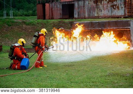 Firefighters Spraying Water To Put Out A Brutal Fire On The Truck.