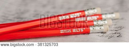 Vietnam, Nha Trang, 14.07.2020: Ielts Red Pencils And Essay Notebook For The English Exam Banner, Lo