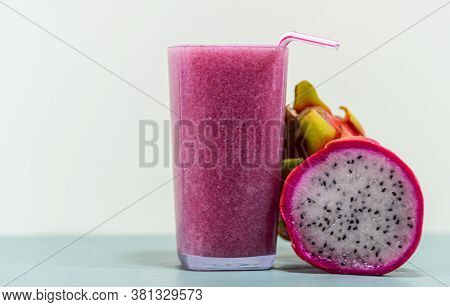 Pitaya Fruit Juice (hylocereus Polyrhizus) On Green Surface And White Background
