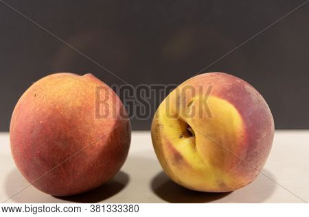 Peach Fruits (prunus Persica) In Natura On A Woody Background