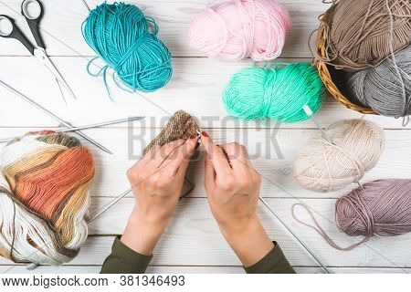 Knitting In Woman Hands. Close-up Of Hands Knitting. Colorful Threads. Selection Of Colorful Yarn Wo