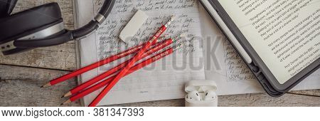 Vietnam, Nha Trang, 14.07.2020: Ielts Red Pencils, Reading Text And Listening Headphones And Essay N