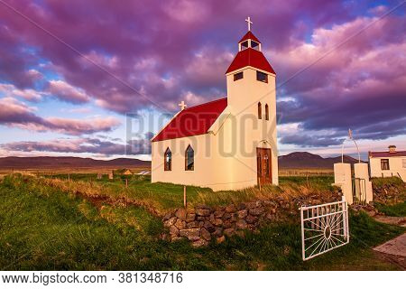Typical Iceland Wooden Church At Sunset In Small Village, In The Northern Iceland, Scandinavia