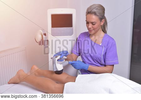 Young Beautiful Woman Gets Professional Body Shape Treatment In A Beauty Clinic