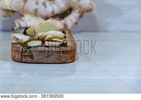 Ginger Root (zingiber Officinale) On Light And Woody Background