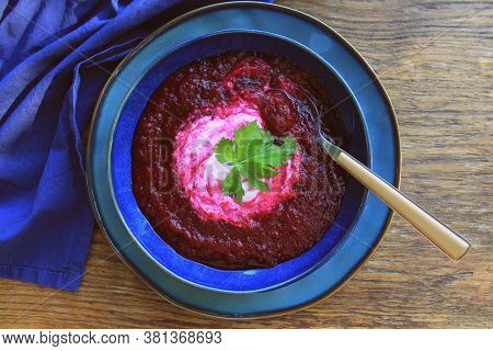 Beetroot Mashed Soup With Sour Cream Over Wooden Background, Top View